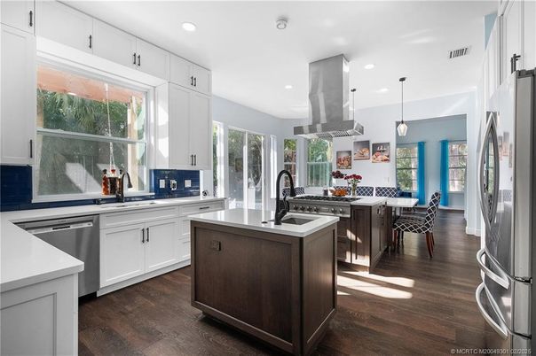 Dining room, Interior, Kitchen, Pendant Lights, Recessed Lighting, Stainless Steel Appliances, Wood Texture Flooring