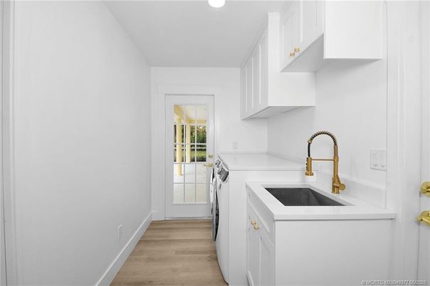 Interior, Kitchen, Recessed Lighting, Washer, Wood Texture Flooring