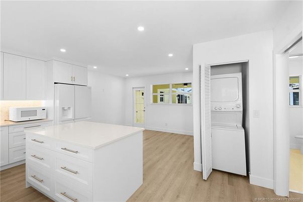 Interior, Kitchen, Recessed Lighting, Washer, Wood Texture Flooring