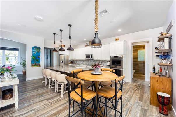 Dining room, Interior, Kitchen, Pendant Lights, Recessed Lighting, Stainless Steel Appliances, Wood Texture Flooring