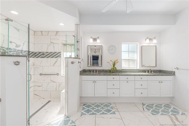 Bathroom, Dual Sink Vanities, Glass Shower, Interior, Marble, Marble Walls, Recessed Lighting