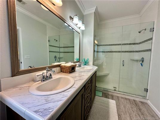 Bathroom, Dual Sink Vanities, Glass Shower, Interior, Tile Countertops, Wood Texture Flooring