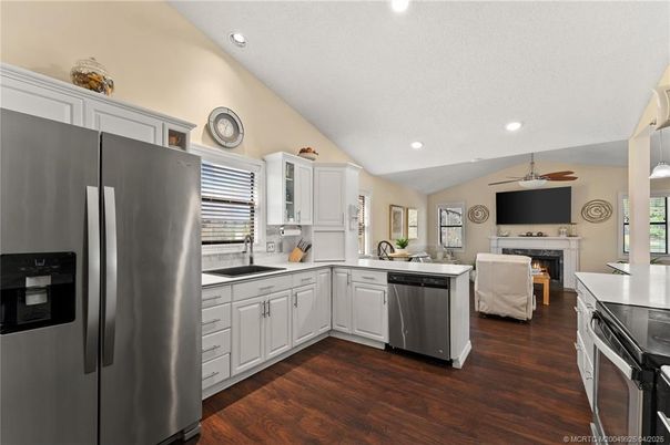 Fireplace, Interior, Kitchen, Living room, Recessed Lighting, Stainless Steel Appliances, Wood Texture Flooring