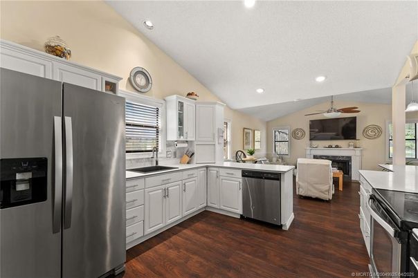 Fireplace, Interior, Kitchen, Recessed Lighting, Stainless Steel Appliances, Wood Texture Flooring