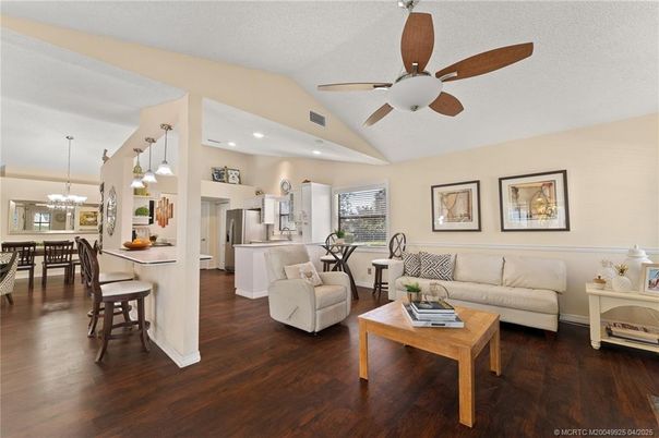 Chandelier, Dining room, Interior, Kitchen, Living room, Pendant Lights, Recessed Lighting, Stainless Steel Appliances, Wood Texture Flooring