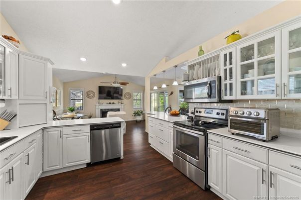 Fireplace, Interior, Kitchen, Pendant Lights, Recessed Lighting, Stainless Steel Appliances, Wood Texture Flooring