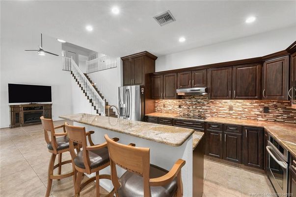 Fireplace, Interior, Kitchen, Recessed Lighting, Stainless Steel Appliances