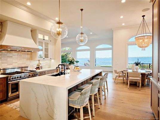 Dining room, Interior, Kitchen, Pendant Lights, Recessed Lighting, Stainless Steel Appliances, Water, Wood Texture Flooring