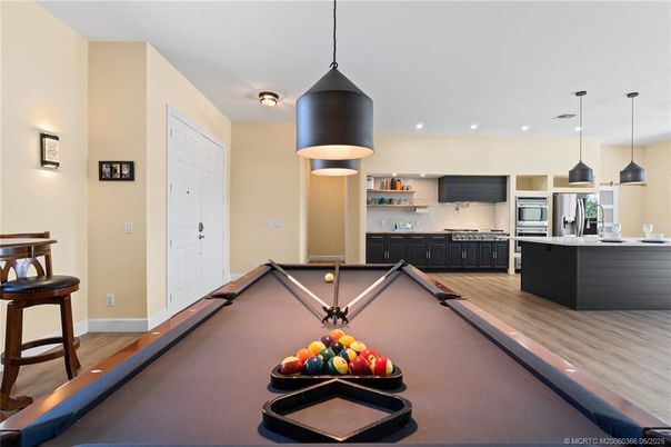 Billiard Table, Game Room, Interior, Kitchen, Pendant Lights, Recessed Lighting, Stainless Steel Appliances, Wood Texture Flooring