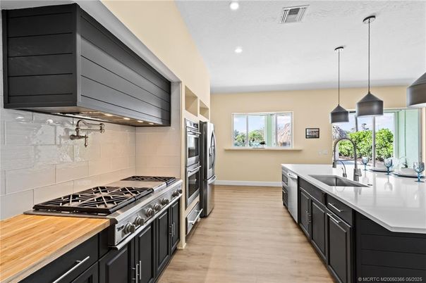 Interior, Kitchen, Pendant Lights, Recessed Lighting, Stainless Steel Appliances, Wood Texture Flooring