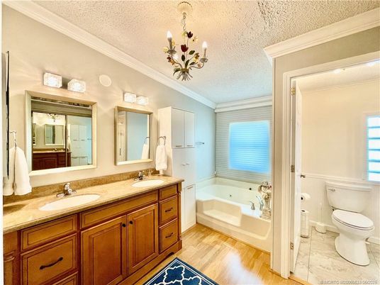 Bathroom, Chandelier, Dual Sink Vanities, Interior, Wood Texture Flooring