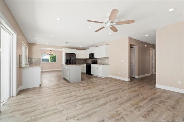 Chandelier, Interior, Kitchen, Recessed Lighting, Stainless Steel Appliances, Wood Texture Flooring