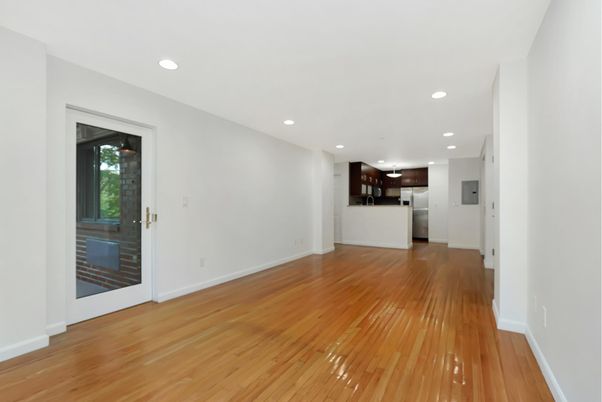 Empty room, Interior, Kitchen, Recessed Lighting, Stainless Steel Appliances, Wood Texture Flooring
