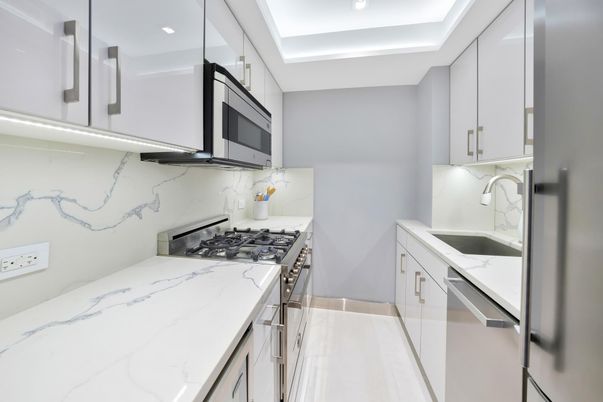Interior, Kitchen, Marble Walls, Recessed Lighting, Stainless Steel Appliances