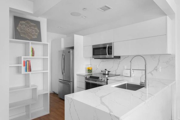 Interior, Kitchen, Marble Walls, Recessed Lighting, Stainless Steel Appliances, Wood Texture Flooring