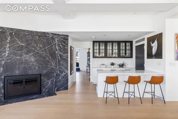 Fireplace, Interior, Marble Walls, Recessed Lighting, Wood Texture Flooring