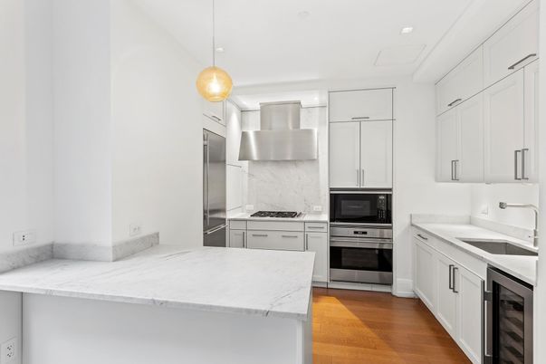 Interior, Kitchen, Marble Walls, Pendant Lights, Recessed Lighting, Stainless Steel Appliances, Wood Texture Flooring