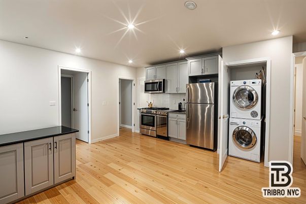 Interior, Kitchen, Recessed Lighting, Stainless Steel Appliances, Utility Closets, Washer, Wood Texture Flooring