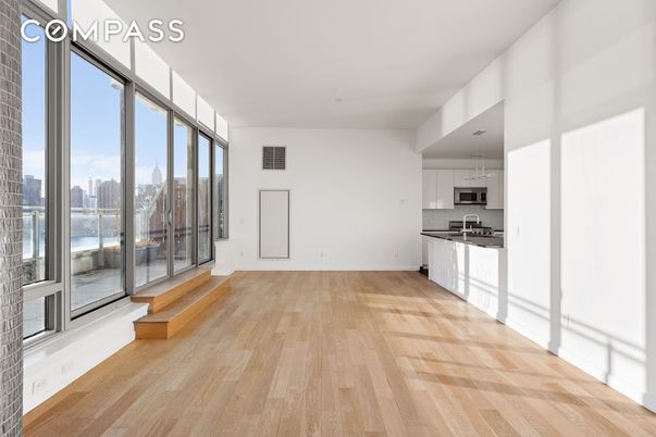 Empty room, Interior, Kitchen, Recessed Lighting, Stainless Steel Appliances, Wood Texture Flooring