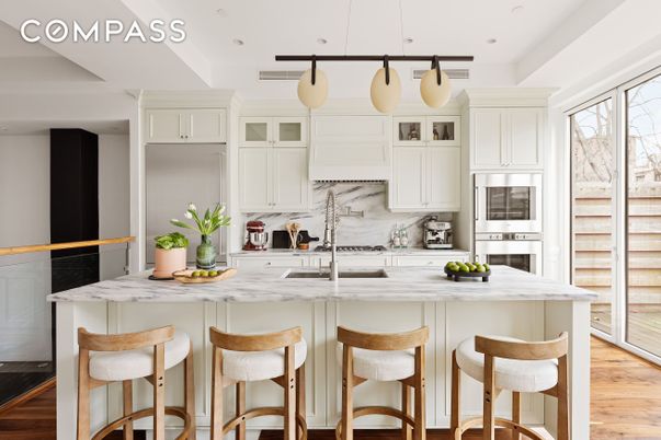 Interior, Kitchen, Marble Walls, Pendant Lights, Recessed Lighting, Stainless Steel Appliances, Wood Texture Flooring