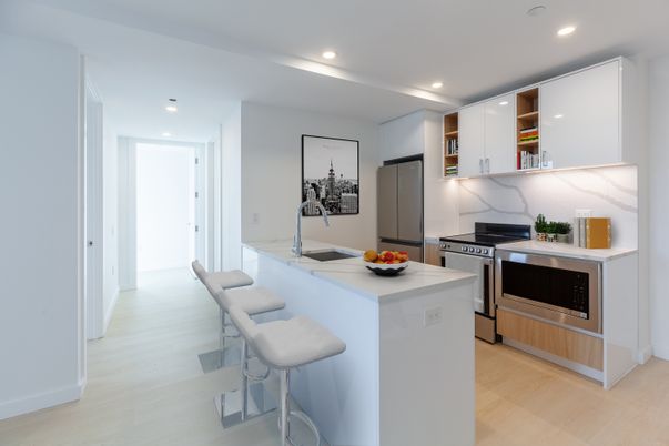 Interior, Kitchen, Marble Walls, Recessed Lighting, Stainless Steel Appliances, Wood Texture Flooring