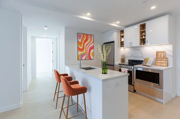 Interior, Kitchen, Marble Walls, Recessed Lighting, Stainless Steel Appliances, Wood Texture Flooring