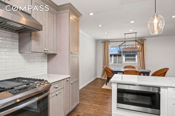 Dining room, Interior, Kitchen, Pendant Lights, Recessed Lighting, Stainless Steel Appliances, Wood Texture Flooring