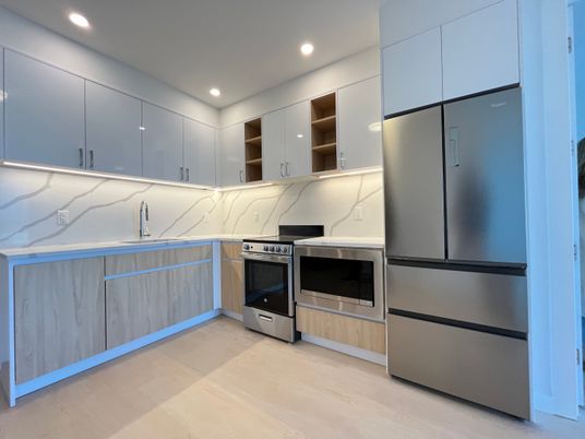 Interior, Kitchen, Marble Walls, Recessed Lighting, Stainless Steel Appliances, Wood Texture Flooring