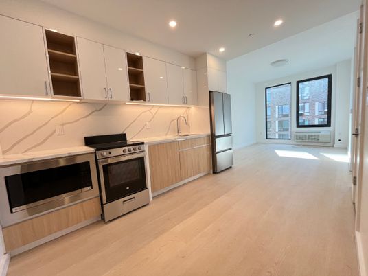 Interior, Kitchen, Marble Walls, Recessed Lighting, Stainless Steel Appliances, Wood Texture Flooring