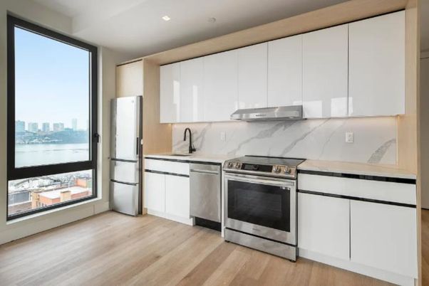 Interior, Kitchen, Marble Walls, Recessed Lighting, Stainless Steel Appliances, Wood Texture Flooring
