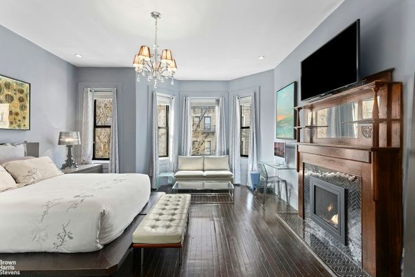 Bedroom, Chandelier, Fireplace, Interior, Recessed Lighting, Wood Texture Flooring