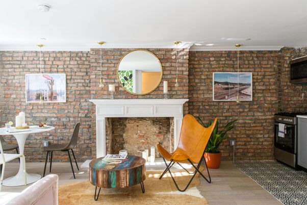 Fireplace, Interior, Living room, Recessed Lighting, Stone Walls, Wood Texture Flooring
