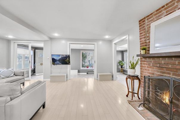 Fireplace, Interior, Living room, Recessed Lighting, Stone Walls, Wood Texture Flooring