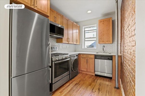 Interior, Kitchen, Recessed Lighting, Stainless Steel Appliances, Washer, Wood Texture Flooring