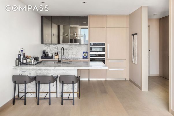 Interior, Kitchen, Marble Walls, Recessed Lighting, Stainless Steel Appliances, Wood Texture Flooring