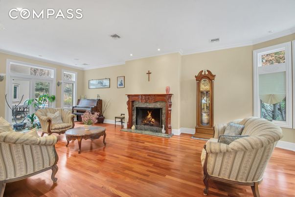 Fireplace, Interior, Living room, Piano, Recessed Lighting, Wood Texture Flooring