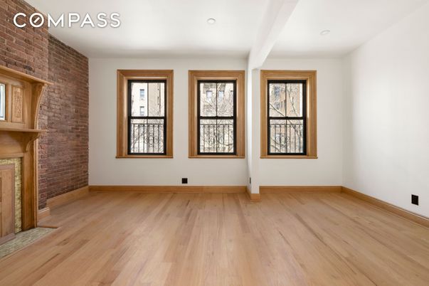 Empty room, Fireplace, Interior, Recessed Lighting, Stone Walls, Wood Texture Flooring