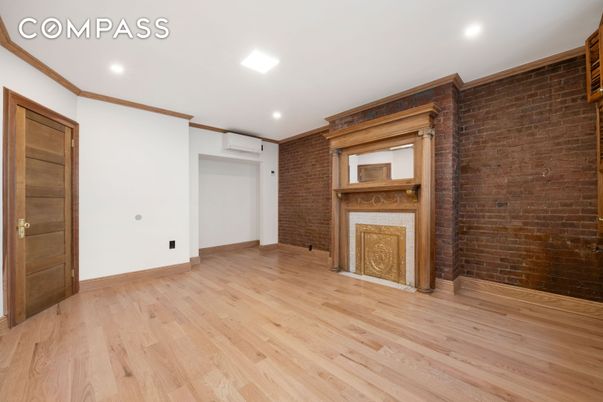 Empty room, Fireplace, Interior, Recessed Lighting, Stone Walls, Wood Texture Flooring