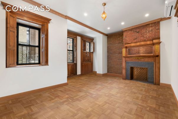 Empty room, Fireplace, Interior, Recessed Lighting, Stone Walls, Wood Texture Flooring