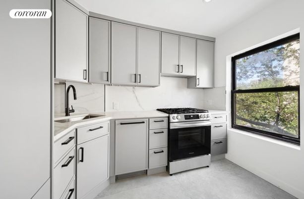 Interior, Kitchen, Marble Walls, Recessed Lighting, Stainless Steel Appliances