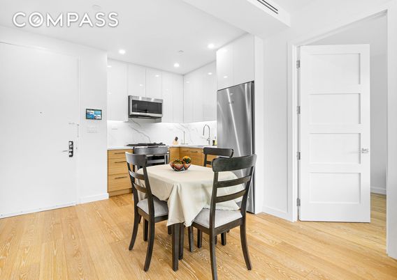 Dining room, Interior, Kitchen, Marble Walls, Recessed Lighting, Stainless Steel Appliances, Wood Texture Flooring