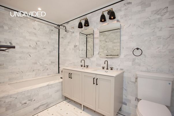 Bathroom, Dual Sink Vanities, Interior, Marble Walls, Recessed Lighting, Wood Texture Flooring