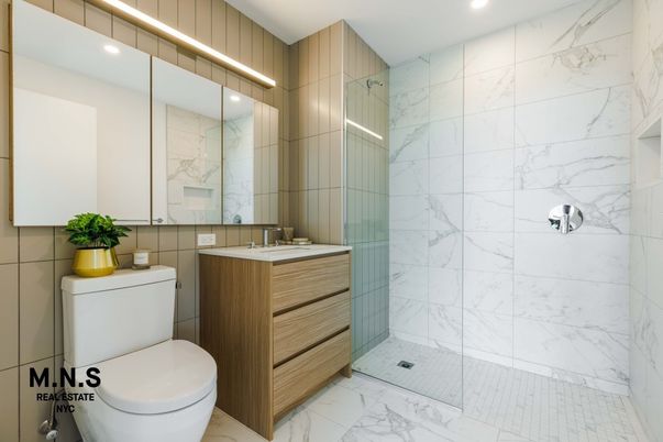Bathroom, Dual Sink Vanities, Glass Shower, Interior, Marble, Marble Walls, Recessed Lighting