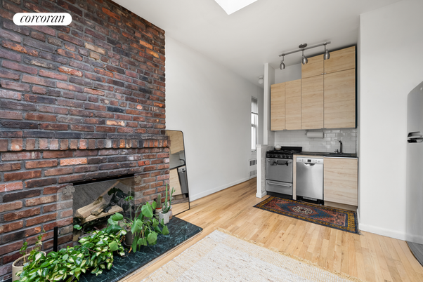 Fireplace, Interior, Kitchen, Stainless Steel Appliances, Stone Walls, Wood Texture Flooring