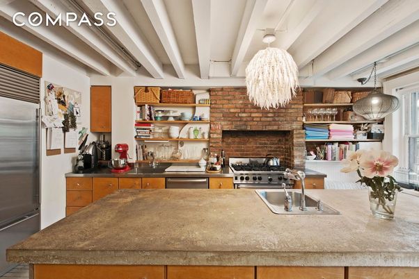 Fireplace, Interior, Kitchen, Pendant Lights, Stainless Steel Appliances, Stone Walls