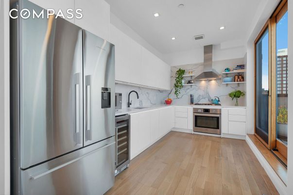 Interior, Kitchen, Marble Walls, Recessed Lighting, Stainless Steel Appliances, Wood Texture Flooring