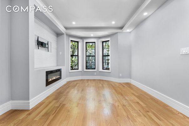 Empty room, Fireplace, Interior, Recessed Lighting, Wood Texture Flooring