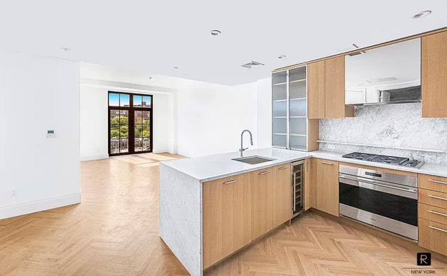 Interior, Kitchen, Marble Walls, Recessed Lighting, Stainless Steel Appliances, Wood Texture Flooring