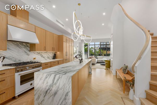 Interior, Kitchen, Marble Walls, Pendant Lights, Recessed Lighting, Stainless Steel Appliances, Wood Texture Flooring