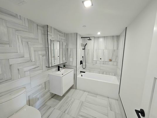 Bathroom, Dual Sink Vanities, Interior, Marble, Marble Walls, Recessed Lighting